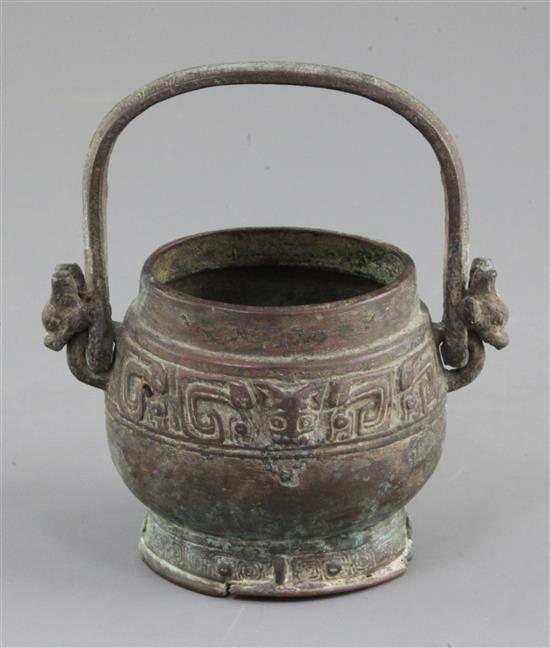 A small Chinese archaic bronze ritual wine vessel, You, Western Zhou dynasty, 10th century B.C., 13cm high, lacking cover